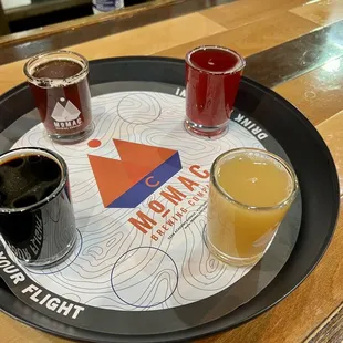 a tray with three different beers