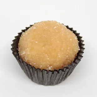 Lilikoi (passion fruit) Brigadeiro with crystal sugar topping.