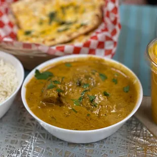 Chicken Korma, cheese naan, mango lassi