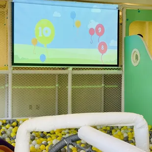 Interactive wall, kids use the balls to play!