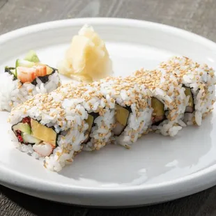 a sushi roll on a white plate