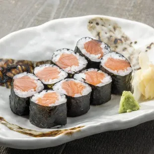 a plate of sushi and a tortilla
