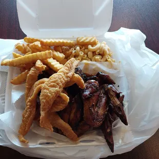 Fish and smoked chicken combo with Mac &amp; cheese and fries.