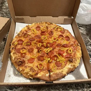 Vegan cheese pizza with banana peppers and regular pepperoni