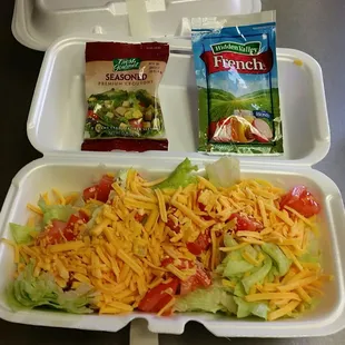 Side salad - lettuce, tomatos, cheddar cheese and croutons. 1 packet of dressing included