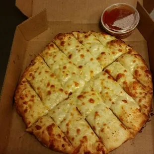 Breadsticks with cheese. (12 in an order.) Includes 1 marinara dipping sauce on the side.