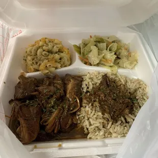 Brown stew chicken, baked Mac and cheese, cabbage