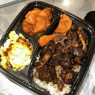 Oxtails with candied yams and mac and cheese