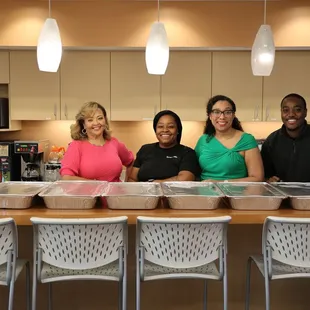 Committee members ready to serve up fried catfish, mojo chicken, collard greens, mac &amp; cheese and banana pudding