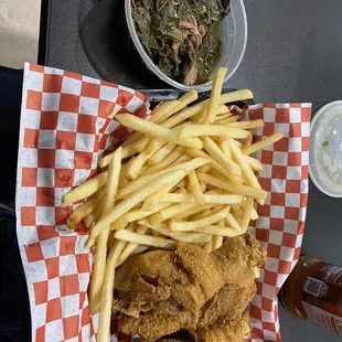 Three piece chicken meal with a side of collards