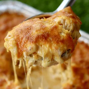 a close up of a spoonful of cheese