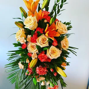 Deluxe peach rose standing spray.