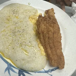 Fish and grits.. you see that butter all in them grits