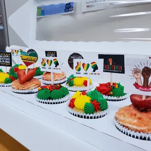 a row of cupcakes with a variety of toppings