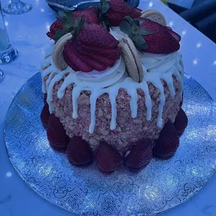 a cake decorated with strawberries and icing