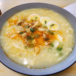 Ohn Noh Khow swae (Coconut Noodle): egg noodles in a chicken curry &amp; coconut milk soup base; boiled egg