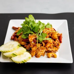 a plate of chicken and cucumber