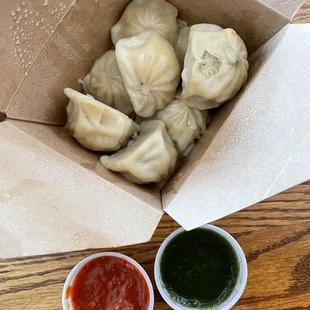 Chicken momo -- the green sauce is spicier than the red one