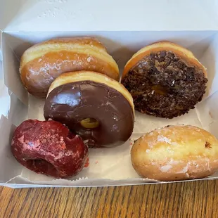 Red velvet, maple bacon, glazed chocolate cream filled, glazed, chocolate glazed