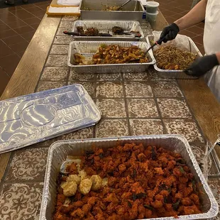 a woman preparing food on a table