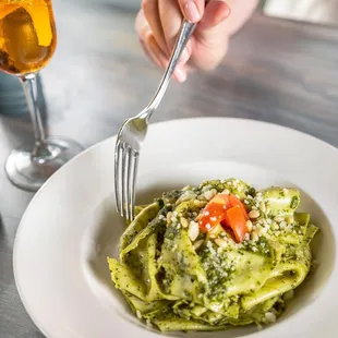 a plate of pasta and a glass of wine