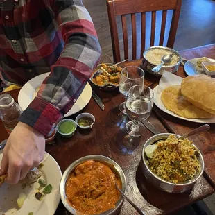 Veg Momo Masala, Vegetable Biryani, 2 Piece Vegetarian Samosa, Poori, Chicken Vindaloo.