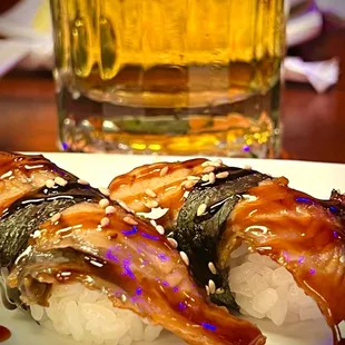 Unagi or eel nigiri with ice cool beer.