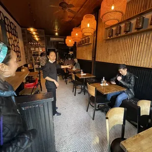 a restaurant with people sitting at tables