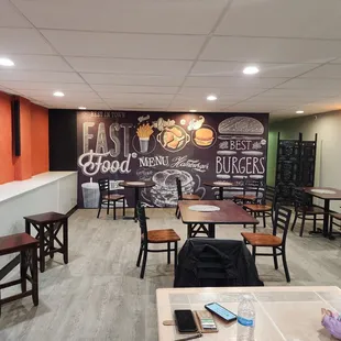 a restaurant with a chalkboard wall