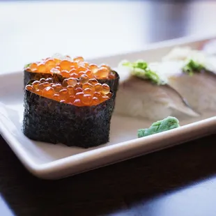 a close up of a plate of sushi