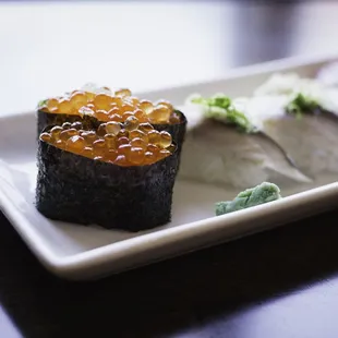 a close up of a plate of sushi