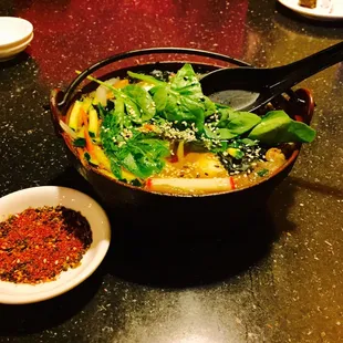 Sukiyaki :) with a side of delicious spicy seasoning that really compliments it and brings everything together.
