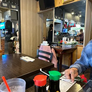 a man sitting at a table in a restaurant