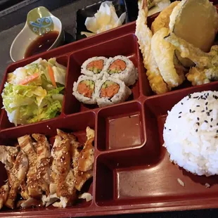 Bento box with chicken teriyaki and spicy tuna roll.