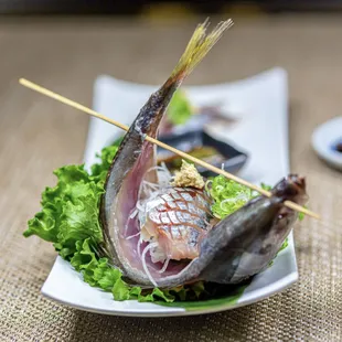 a close up of a fish on a plate