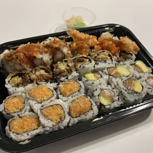 Top to bottom: shrimp tempura, eel, spicy salmon, and salmon avocado