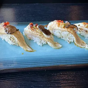 Torched hirame engawa topped with truffle slice