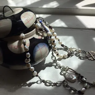 Rachel Donner porcelain jar with a pony and pearls necklaces