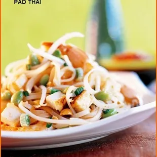 a plate of pad thai noodles