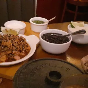 Taquitos pollo with black beans and rice. Comes with corn tortillas