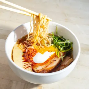Smoked Pork Ramen with pork belly, a poached egg, and bamboo.