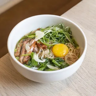 Garlic Chicken Ramen with yu choy, a poached egg, and garlic.