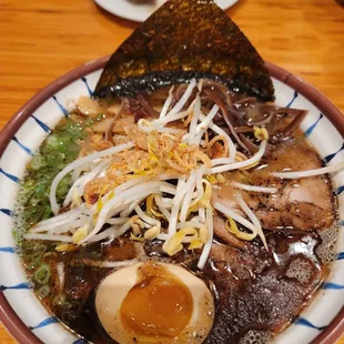 a bowl of ramen and a boiled egg