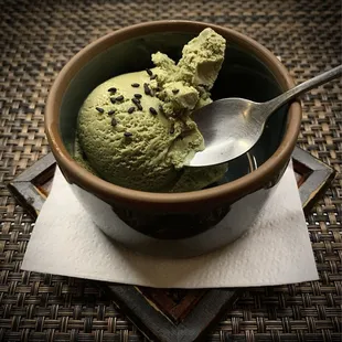 Matcha ice cream with black sesame seeds.