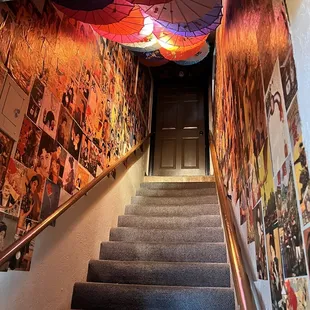 Nicely decorated stairwell that builds anticipation for upstairs