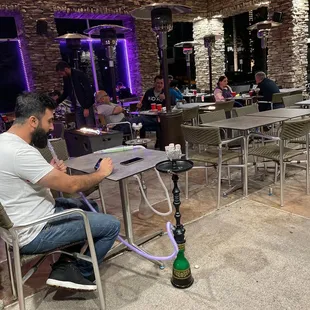 Patio open now at Momo's Grill serving hookah and food.