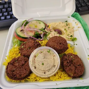 Falafel rice place to go (pita provided on the side)