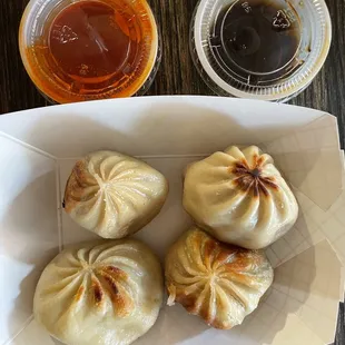 a plate of steamed dumplings