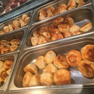 a variety of pastries in trays