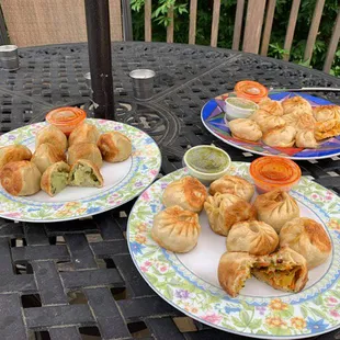 two plates of food on a patio table